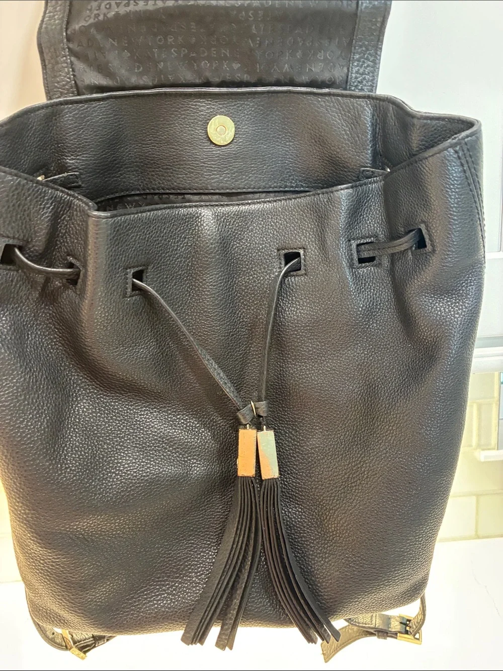 kate spade Black Pebbled Leather Tassel Drawstring Backpack